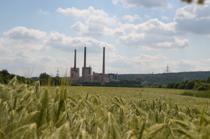 Power stations, in the foreground a grain field