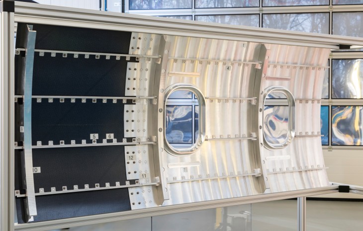 Various solid phase joining processes are demonstrated on a model of an aircraft fuselage part.